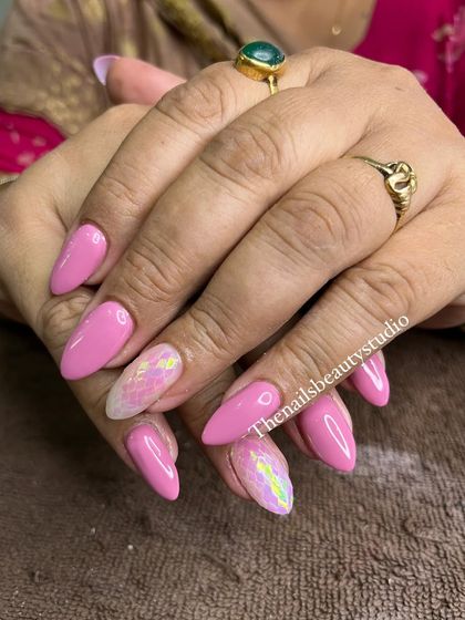The full set of these vibrant pink nails, perfect for anyone who loves a pop of color and sparkle.