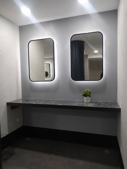 A secondary vanity and grooming station in the Chakra studio washroom. The floating countertop design creates a sense of spaciousness and makes the area easy to maintain.