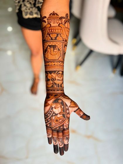 A detailed view of the right arm, showcasing the Radha portrait and the New York City skyline. The combination of divine love and personal history makes this design one of a kind.