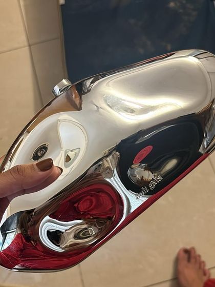 How cool is this metallic clutch? It's such a fun, futuristic accessory that adds an unexpected edge to an evening outfit.