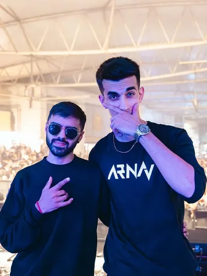 Posing with fellow artist AJ Wavy on stage in front of a massive concert crowd. I have a strong track record of collaborating with other performers in a live setting.