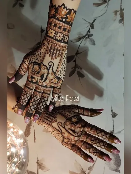 A beautiful pose showcasing the elephant back-hand design, with fairy lights adding a magical touch.