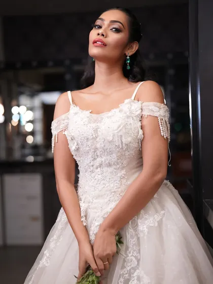A full-length shot of a Christian bride in a beautiful white gown. The styling is elegant and timeless.