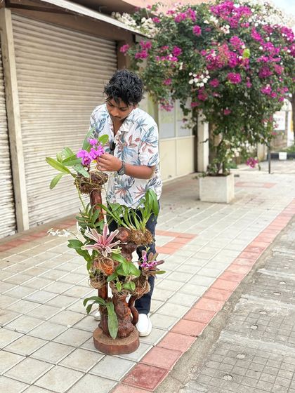 A closer look at the beautiful orchid arrangement. We take pride in every detail, whether it's a large landscape or a small, intricate floral display.