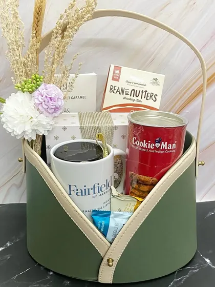 A single view of the elegant olive green and beige basket for Fairfield by Marriott, perfect for welcoming guests.
