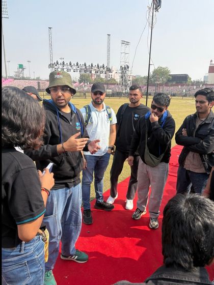 A team briefing on the red carpet area before the Khelo India University Games opening ceremony. We coordinate all teams to manage the flow of athletes and dignitaries.