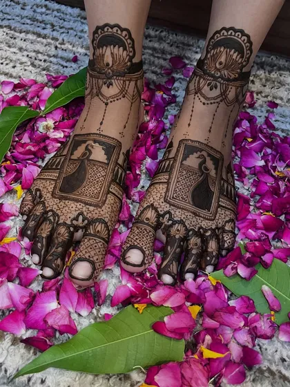 The same beautiful peacock feet design, now adorned with fresh flower petals. This is how the mehendi looks right after application, ready for the wedding festivities.