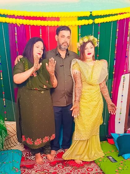 A happy family moment during a mehndi ceremony. It's an honor to be a part of such special celebrations.