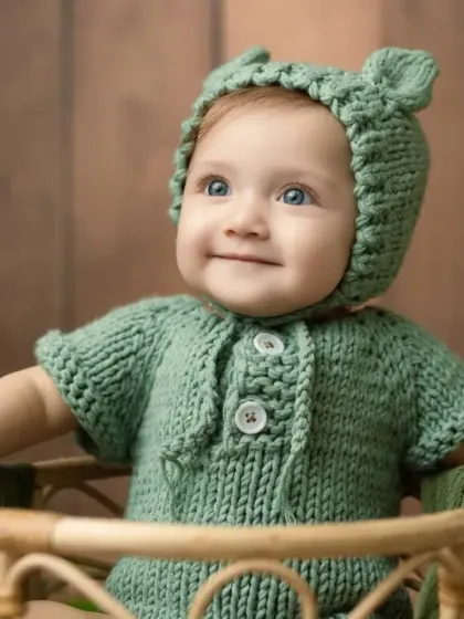 A sweet, thoughtful expression from our little bear, sitting in a rustic wicker basket.