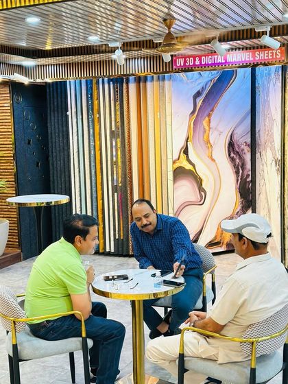 We believe in a hands-on approach. Here, I am personally walking a client through the design options and showing them digital mockups on my phone.