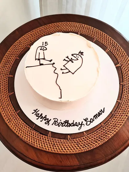 A minimalist "flork of cows" meme cake, perfect for adding a touch of humor to a 15th birthday celebration.