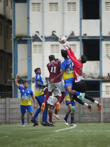 Our goalkeeper in full flight during a competitive match. We provide specialized coaching to ensure our keepers are dominant in the box and crucial to the team's success.
