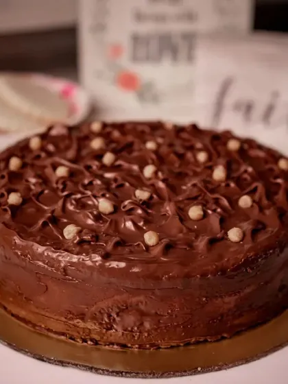 This is our Nutella Hazelnut Cake, a crowd-pleaser with its rich chocolate frosting and crunchy hazelnut pieces. It's a truly decadent treat.