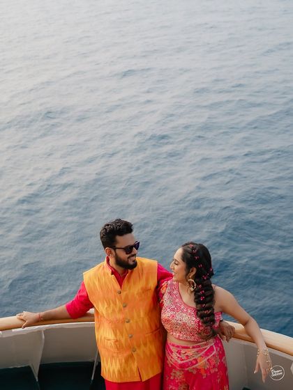 A vibrant Haldi celebration on the deck of a cruise ship, with the endless blue of the Arabian Sea as the backdrop. This unique setting combines the energy of a celebration with the serenity of the ocean.