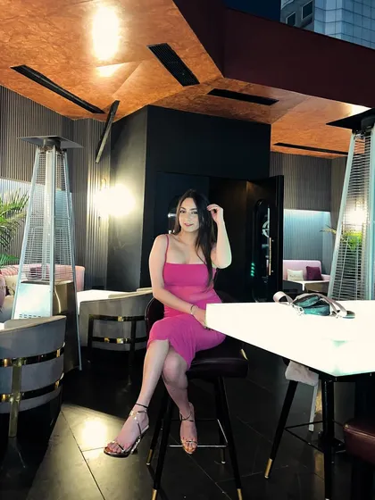 A birthday celebration look. This photo in a bright pink dress shows how I document special occasions and personal style.