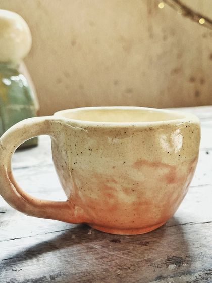 After her beginner's course, this student rejoined for the advanced level. She created beautiful wheel-thrown mugs and bowls, and also explored sculptural hand-building, creating this unique candlestick holder.