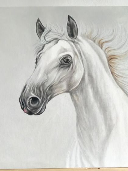Another angle of the white horse acrylic painting. The subtle shading and fine details on the 2x2 ft canvas give the portrait a soft, almost ethereal quality.