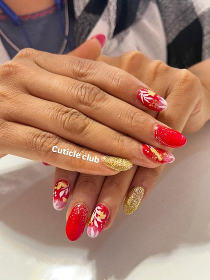 This festive red and gold design is perfect for the bridal season. It features a combination of solid red, gold glitter, and white floral art with gold foil details.