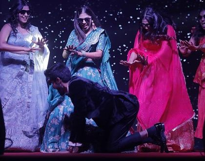 The groom joins the bride's squad for a playful moment on stage. We love creating routines that are interactive and fun for everyone.