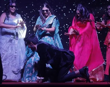 The groom joins the bride's squad for a playful moment on stage. We love creating routines that are interactive and fun for everyone.