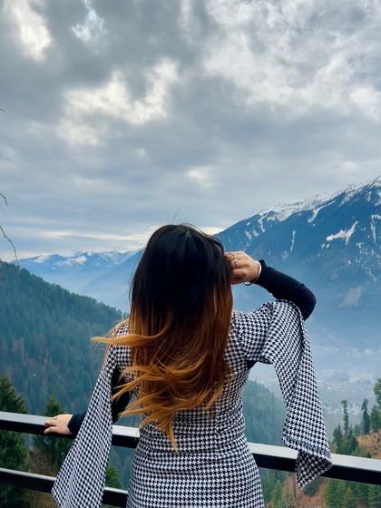 A back view of the cape dress, with my hair blowing in the mountain wind. This shot is all about capturing the feeling of freedom and adventure.