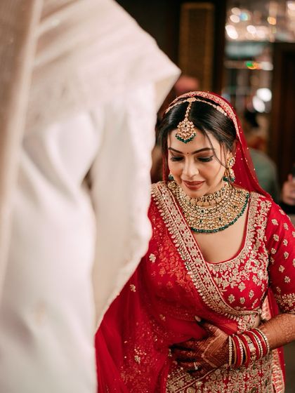 A quiet, emotional moment as the bride looks towards her groom. We capture the subtle expressions that speak volumes.