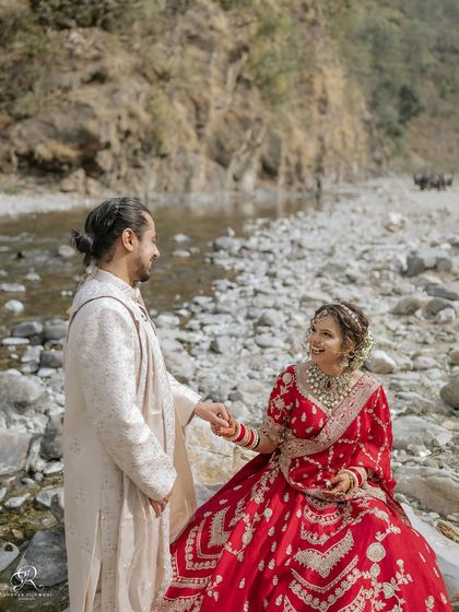 After their wedding ceremony in Rishikesh, we took some time for portraits by the river. This quiet moment of them holding hands shows the beginning of their new journey together.