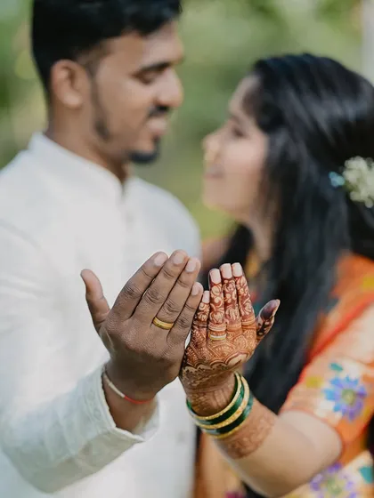 Another shot of the couple, with the bride's mehendi stain looking absolutely stunning. The deep color is a sign of pure, natural henna.