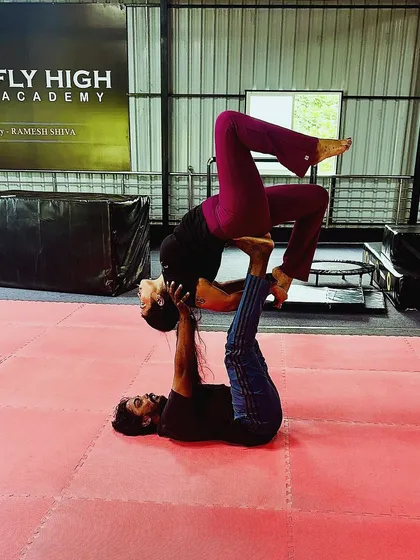 Another variation of an acro yoga pose, showcasing the creativity and skill of our adult students.