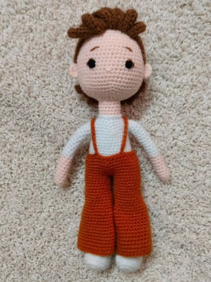 This male doll was a custom order for a fan of a popular singer. I made his orange bell-bottom pants and white shirt, just like in the photo.
