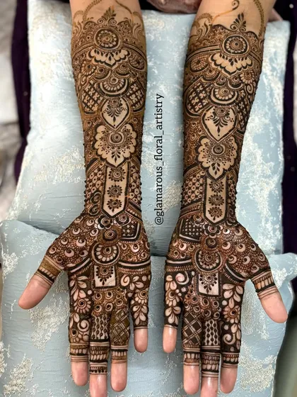 A perfect example of a traditional, symmetrical bridal design. The clean lines, detailed patterns, and balanced composition make this a timeless choice for any bride.