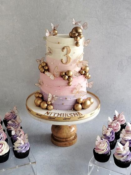 A lovely butterfly-themed cake for Nithiksha's 3rd birthday. I love this soft pastel colour palette, with an ombre effect on the cake and delicate, edible butterflies all around.
