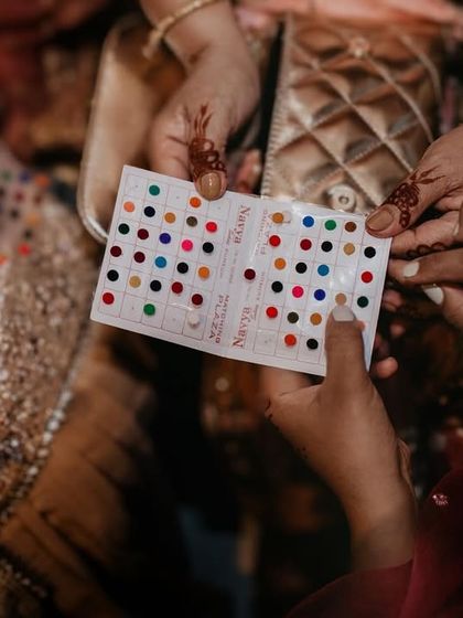 A small, colorful detail. The sharing of bindis is a moment of connection and tradition that I love to capture up close.
