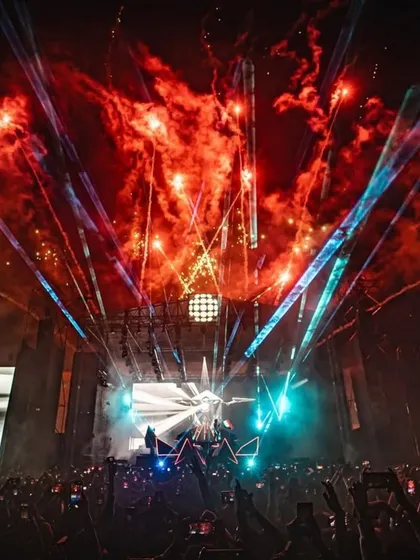 A massive explosion of fireworks and lasers creates a breathtaking moment of organized chaos at the Alan Walker show.