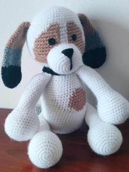 A close-up of my custom-made dog with white and brown patches.