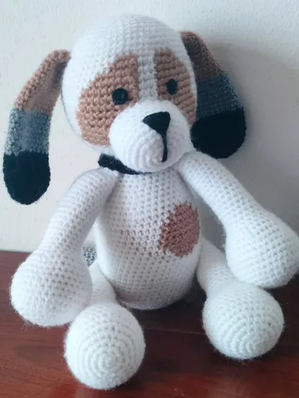 A close-up of my custom-made dog with white and brown patches.