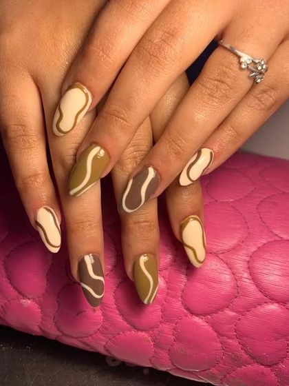 A trendy and chic design with an earthy color palette of browns and beiges in an abstract swirl pattern.