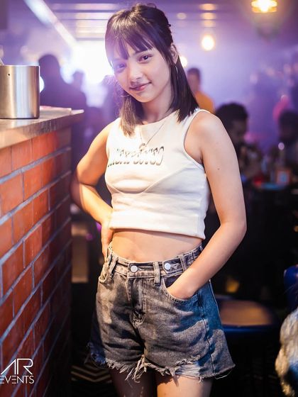 A guest posing at the bar.