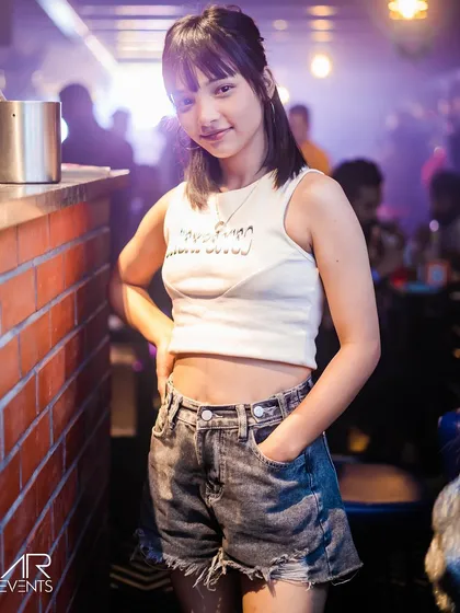 A guest posing at the bar.