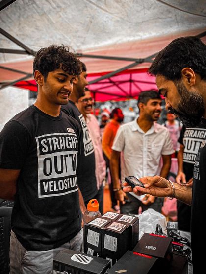 Browsing for deals. The Velo Studio stall is busy with customers looking for new gear and accessories.