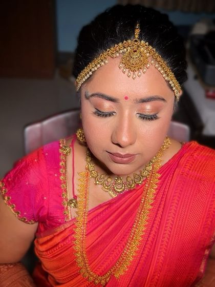 A close-up of this bride's soft glow, with shimmery eyeshadow and a natural lip that enhances her features beautifully.