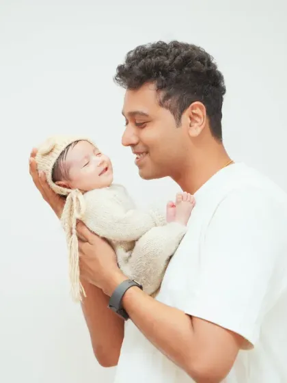 The special bond between a father and his newborn baby. These quiet, tender moments are among the most precious to capture.