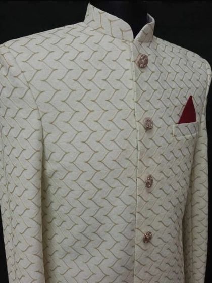 Another beautiful off-white sherwani fabric option with a subtle geometric pattern. I can source a wide variety of premium materials for your wedding outfit.