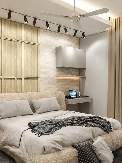 This angle highlights the view from the window and the smart use of track lighting to illuminate the room. The combination of a soft bed and a dedicated workspace makes this room perfect for modern living.