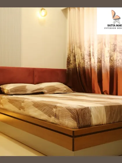 Another view of the bedroom with the rust-colored headboard, showcasing the soft lighting and simple, elegant design.