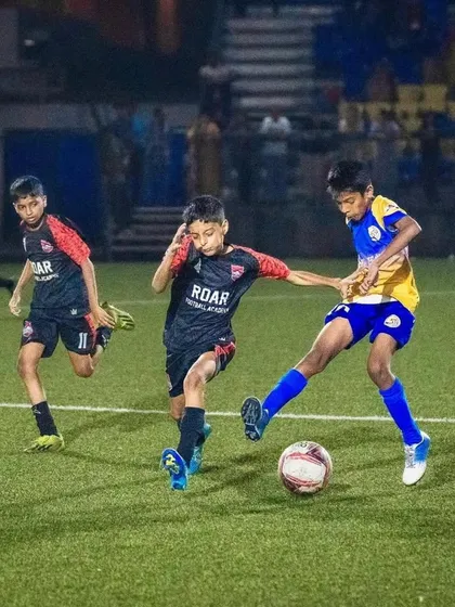 Battling for possession in the midfield during the U13 semi-finals of the Thane Youth League.