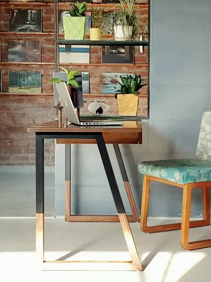 The Cantil study table is our answer to the modern home office. Its sleek, minimalist design features a solid wood top and an angular metal frame, providing a stylish and functional workspace that doesn't clutter the room.