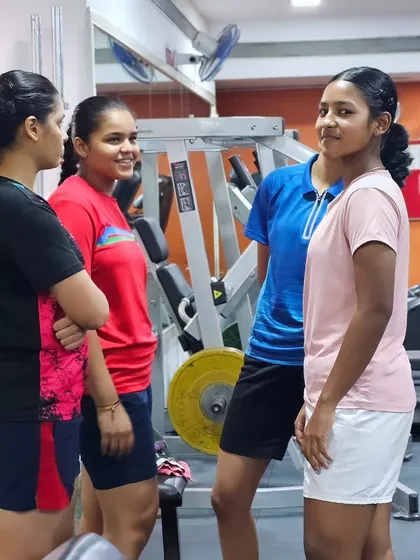 Our female athletes discussing their training in the gym. We are proud to train a strong contingent of dedicated female players.