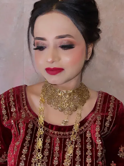 A look created for our bride as per her demand. This photo, taken in low light, still shows the beautiful details of the eye makeup and the rich red lip.