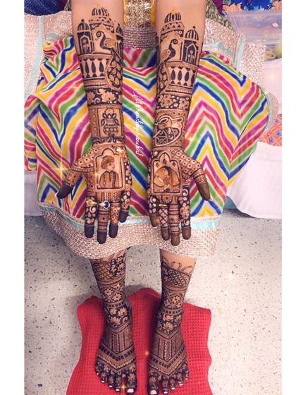 A complete bridal look with portraits of the bride and groom on the palms, and full intricate designs on the hands and feet.